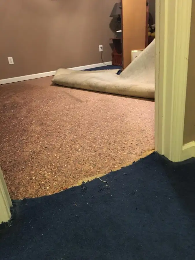 Carpet pad removal revealing water damage during Drying & Dehumidification in Soquel