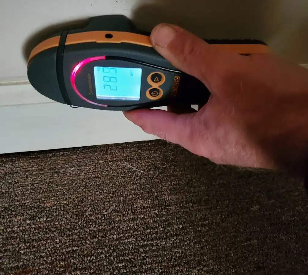 Moisture detection at baseboard during Storm Damage Restoration in Soquel